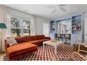 Inviting living room with a sectional sofa, built-in bar, and ample natural light at 2128 Golfview Dr, Charleston, SC 29412