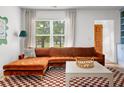 Comfortable living space with a plush sofa, large window, and cozy decor at 2128 Golfview Dr, Charleston, SC 29412