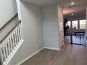 Bright, neutral hallway leads to light-filled rooms in a modern home at 244 Tuscan Sun St, Summerville, SC 29485