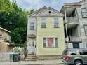 Two-story home featuring light yellow siding and traditional architectural details at 3 Hanover St, Charleston, SC 29403