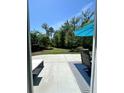 View of the backyard from the screened in porch, highlighting the green space at 315 Grouse Park, Charleston, SC 29414