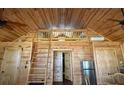 Spacious living area with vaulted wood ceilings, loft access, and modern appliances at 3360 Baldwin Ln, Green Pond, SC 29446