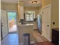 Efficient kitchen with granite countertops, stainless steel appliances and easy access to a deck at 339 Sea Cloud Cir, Edisto Island, SC 29438