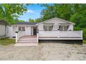 Charming home with white siding, black trim, and cozy front porch at 358 Highway 78, Ridgeville, SC 29472