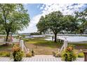 Scenic water view from a porch, enhanced with mature trees and marsh grass at 3948 Gift Blvd, Johns Island, SC 29455