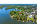 Aerial view showcasing property location with waterfront access, surrounded by trees at 423 Lake Moultrie Dr, Bonneau, SC 29431