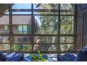 Cozy screened porch with comfortable seating and views of surrounding nature at 4233 Mariners Watch, Johns Island, SC 29455
