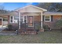Inviting brick front porch with decorative railing and a charming entrance at 4765 S Constellation Dr, North Charleston, SC 29418