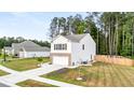 Inviting home with a brick-accented garage, lush lawn, and tidy landscaping at 514 Shady Maple St, Moncks Corner, SC 29461