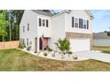 Attractive home with neat landscaping, brick-accented garage, and welcoming front entrance at 514 Shady Maple St, Moncks Corner, SC 29461