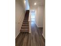 Elegant entryway showcasing hardwood floors and staircase leading to the upper level of the home at 538 Pender Woods Dr, Summerville, SC 29486