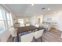 Bright, open-concept living space with a dining area and modern kitchen, perfect for entertaining at 542 Pender Woods Dr, Summerville, SC 29486