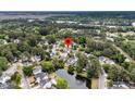 Picturesque neighborhood with lush greenery, serene pond, and well-maintained homes, ideal for peaceful living at 613 Antebellum Ln, Mount Pleasant, SC 29464