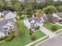 Beautiful two-story home boasting mature trees and a lush green lawn, creating a serene atmosphere at 613 Antebellum Ln, Mount Pleasant, SC 29464