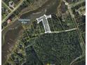 Expansive property showcasing wooded acreage, and waterfront access at 6518 Beagle Club Rd, Meggett, SC 29449