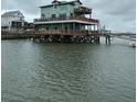 Unique waterfront home on stilts, featuring multiple decks for relaxing and enjoying the scenic views at 67 W 10Th St # E-3, Folly Beach, SC 29439
