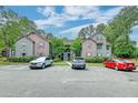 Apartment building with assigned parking spaces and a manicured landscape at 7955 Timbercreek Ln # 1807, North Charleston, SC 29418