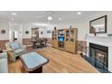 Inviting living space with a cozy fireplace, hardwood flooring, and an open layout at 8 Town Park Ln # C, Charleston, SC 29412