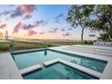Beautiful pool and water view with manicured lawn, patio, and landscaping at 80 On The Harbor Dr, Mount Pleasant, SC 29464