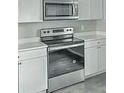 Modern kitchen with stainless steel oven and white cabinets at 960 Savage Road Rd, Charleston, SC 29414