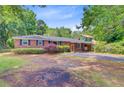 Inviting brick home with neat landscaping and a convenient carport at 106 Newington Rd, Summerville, SC 29485