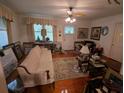 Inviting living room with a plush sofa, ceiling fan, and bright natural light at 1259 Wisteria Rd, Charleston, SC 29407