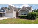 Attractive single-Gathering home featuring a manicured lawn and an attached garage at 1315 Palm Cove Dr, Charleston, SC 29492