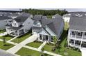An aerial view showcases this home in a vibrant neighborhood with well-maintained lawns and neatly arranged streets at 172 Helena Park Dr, Summerville, SC 29486
