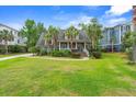 Charming home with palm trees, well-maintained lawn, and inviting front porch at 1721 Bowline Dr, Mount Pleasant, SC 29466