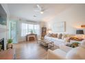 Inviting living room with fireplace, white furniture, and natural light at 2011 N Highway 17 # 2300F, Mount Pleasant, SC 29466