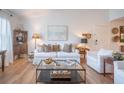 Comfortable living room with white sofa, light wood floors, and ample seating at 2011 N Highway 17 # 2300F, Mount Pleasant, SC 29466