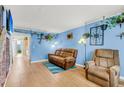 Inviting living room with plush seating, hardwood floors, and bright, fresh paint at 21 Rivers Point Row # Apt 11 C, Charleston, SC 29412