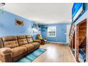 Relax in this inviting living room with hardwood floors and large TV at 21 Rivers Point Row # Apt 11 C, Charleston, SC 29412