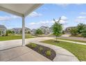 Picturesque street view from the porch, showcasing a well-manicured lawn and neighboring homes in a quiet neighborhood at 212 Palmetto Walk Dr, Summerville, SC 29486