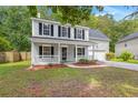 Charming two-story home with a well-manicured lawn and front porch at 240 Eagle Ridge Rd, Summerville, SC 29485