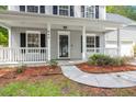 Inviting front porch view, highlighting well-maintained landscaping, a walkway and cozy architectural details at 240 Eagle Ridge Rd, Summerville, SC 29485