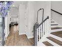 Bright foyer with hardwood floors, staircase, and an open view into the living area at 2844 Pinelog Ln, Johns Island, SC 29455