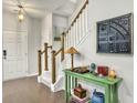 Welcoming entryway with a staircase, modern lighting, and stylish décor at 312 Silverdrop St, Goose Creek, SC 29445