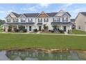 A picturesque townhouse community overlooks a serene pond and lush green lawns at 312 Silverdrop St, Goose Creek, SC 29445