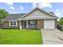 Charming single-story brick home with a well-maintained lawn, driveway, and front porch at 313 Janice St, Goose Creek, SC 29445
