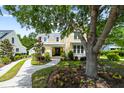 Beautiful yellow home with well-manicured lawn and mature trees at 3413 Acorn Drop Ln, Johns Island, SC 29455