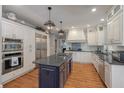 Spacious kitchen featuring custom cabinets, stainless steel appliances, and a large center island at 3601 Colonel Vanderhorst Cir, Mount Pleasant, SC 29466