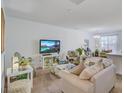 Bright and airy living room with neutral colors, plush seating, and plenty of natural light at 4966 Hay Bale Ct, Summerville, SC 29485