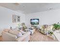 Cozy living room featuring stylish furniture, decorative plants, and ample space for relaxation and entertainment at 4966 Hay Bale Ct, Summerville, SC 29485