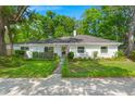 The front exterior features lush landscaping and a well-maintained lawn enhancing curb appeal at 672 W Oak Forest Dr, Charleston, SC 29407