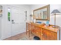 Inviting entryway with a wood accent table, large mirror, and decorative lamps at 1035 Planters Curve, Mount Pleasant, SC 29464