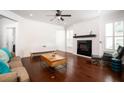 Living room featuring hardwood floors, a fireplace, and neutral colors at 104 Antilles Cir, Charleston, SC 29492