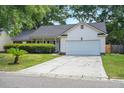 Classic single Gathering home with a concrete driveway and an attached garage at 109 New Spring Ct, Summerville, SC 29485