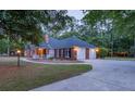 Brick home featuring an attached garage and circular driveway at 111 Coltsgate Ct, Summerville, SC 29485