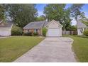 Inviting single-Gathering home with a neat lawn, driveway, and charming curb appeal in a peaceful setting at 111 Macfarren Ln, Summerville, SC 29485